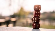 Red dice stacked on table on terrace